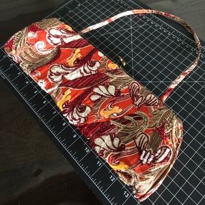 Santi, vibrant beaded handbag with bronze clasp